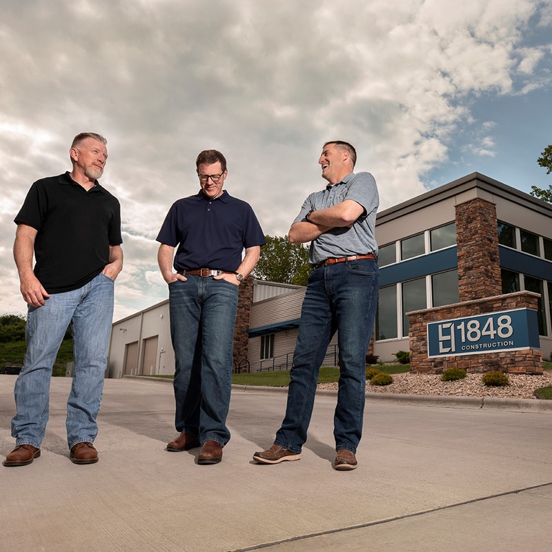 Owners of 1848 Construction in Driveway